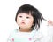 Asian baby girl touch hair