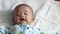 Asian baby wakeup and smile after wakeup. Healthy Adorable Infant Laughing