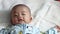 Asian baby wakeup and smile after wakeup. Healthy Adorable Infant Laughing