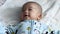Asian baby wakeup and smile after wakeup. Healthy Adorable Infant Laughing