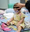 Asian baby was sick as Respiratory Syncytial Virus RSV in kid hospital.