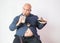 Asian bald fat man with big belly happy in food