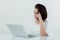 Asian beautiful woman Sitting in a white shirt On the front desk, there is a laptop computer placed. Expression There is work