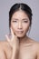 Asian beauty skincare woman touching skin on face