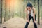 Asian beauty woman tiring from jogging in forest. Towel and sweat elements. Sport and Healthy concept. Jogging and Running concept