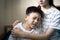 Asian big sister was embracing,comforting little brother,give advice,talk sharing thoughts care,support,loving teen girl speak