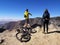 Asian biker man pointing and caucasian hiker woman enjoying the view from Sardine Peak Trailhead