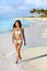 Asian bikini woman walking on beach holidays