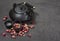 Asian black traditional teapot with dry roses for tea ceremony