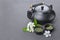 Asian black traditional teapot and teacups with green tea for ceremony