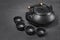 Asian black traditional teapot and teacups for tea ceremony