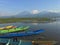 Asian boat rests on the edge of Lake