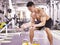 Asian bodybuilder exercising in gym