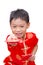 Asian boy with Chinese traditional dress giving ang pow