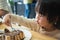 Asian boy eating honey toast