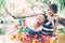 Asian boy and gril playing wooden block toy on table for creative and development with enjoy.