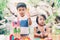 Asian boy and gril playing wooden block toy on table for creative and development with enjoy.