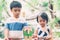 Asian boy and gril playing wooden block toy on table for creative and development with enjoy, happy child learn skill for activity