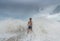 An Asian boy has felt happy and fun on the beach with a cloudy sky