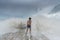 An Asian boy has felt happy and fun on the beach with a cloudy sky