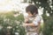 Asian boy holding american short hair kitten