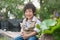 Asian boy holding american short hair kitten