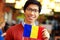 Asian boy holding flag of Romania