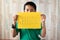 Asian boy holding paper note written `nothing` word