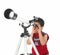 Asian boy looking through a telescope