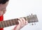 Asian boy playing guitar And look down at the hands that are holding the chords, play a song