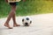 Asian boy playing old football on street,kids are playing soccer