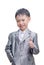 Asian boy in suit smiling with thumb up