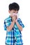 Asian boy using tissue to wipe snot from his nose. Isolated on w