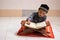 Asian boy who learns to read Al-Qur`an