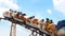 Asian boys on a roller coaster ride. selected focus