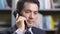 Asian business executive talking on phone