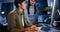 Asian business man and woman work late night together on desktop computer with team in home office