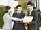 Asian business people meeting in company lobby