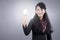 Asian business woman with light bulb