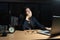 Asian business woman is sitting yawning with a hand covered her mouth, Laptop, on the desk, While the young woman works overtime