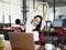 Asian business woman stretching arms in office