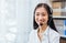 Asian business woman wear headset and working on telemarketing with online customer support.