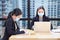 Asian business woman working together in co-working space following social distancing and new normal policy by wearing facial mask