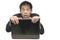 Asian businessman hiding behind laptop