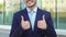 Asian businessman show double thumbs up
