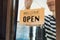 Asian businessman turning round tablet open on door