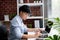 Asian businessmen are calculating numbers on the white table in the office