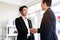 Asian businessmen handshake for the teamwork of business mergers and acquisitions for successful negotiation. Two businessmen