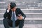 Asian businessmen with headaches or migraines at the city hall after work Images of young businessmen who are tired, stress, crisi