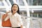 Asian businesswoman holding colorful paper shopping bags on hand , business consumer concept